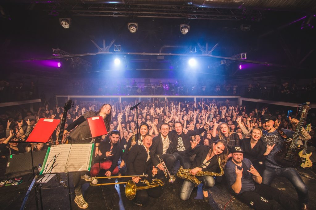 image of russian blues band wicked rumble on stage with large crowd in the background