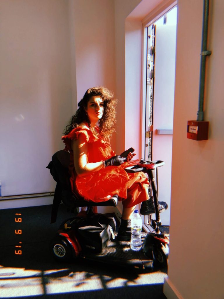 image of singer ruth patterson sitting on her scooter