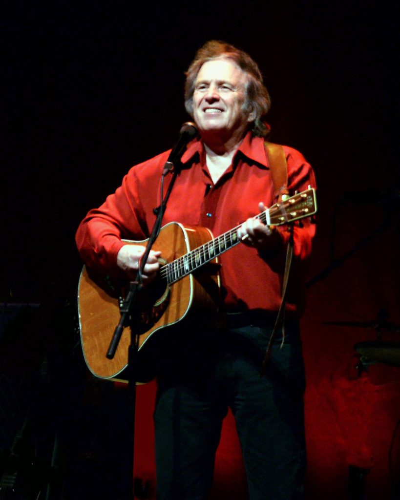 image of don mclean in red shirt with guitar