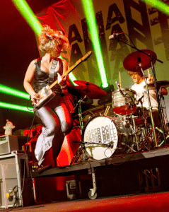Image of Samantha Fish jumping at a live show