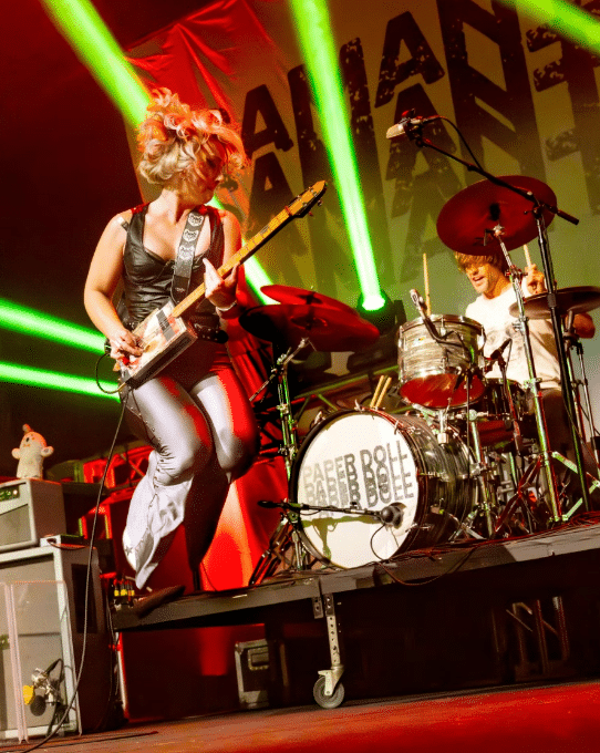 Image of Samantha Fish jumping at a live show